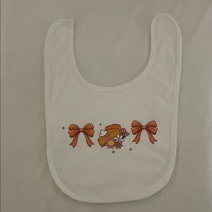 Charming White Bib with Orange Bow Accents